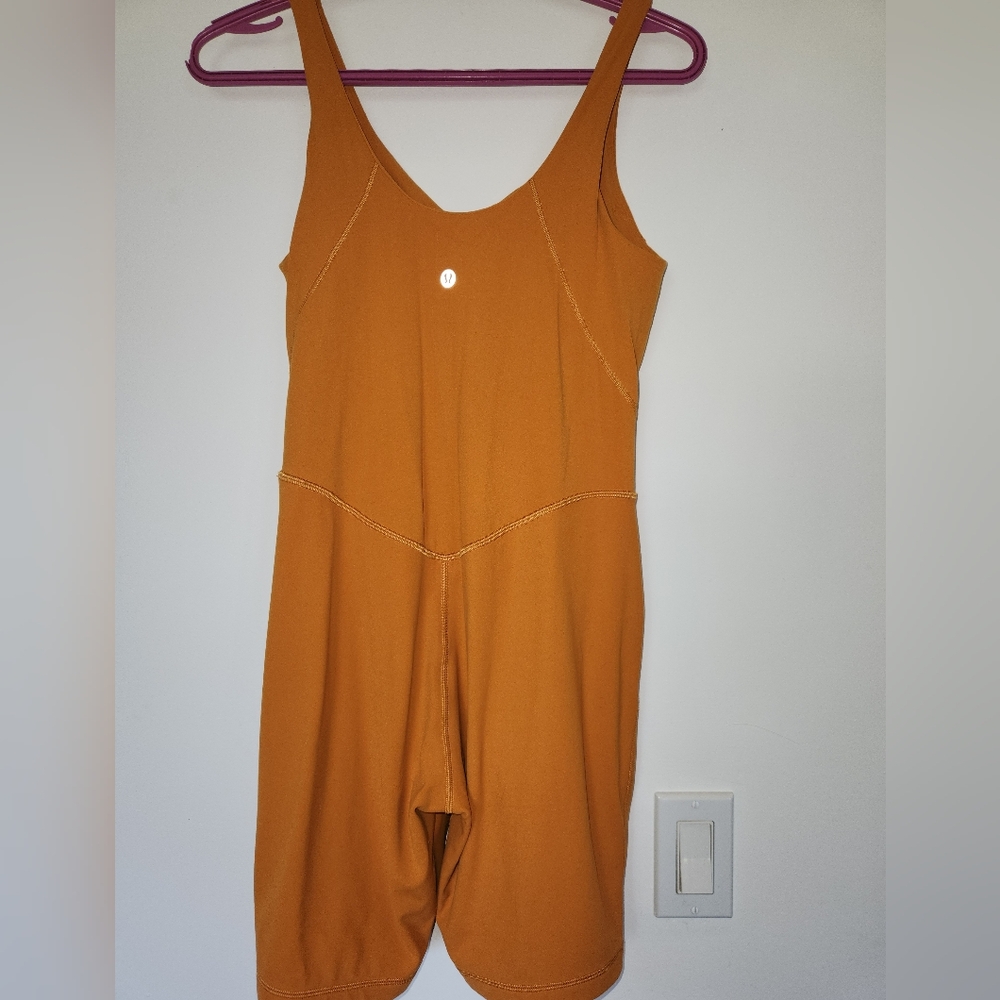 Lululemon Athletica Orange V-Neck Jumpsuit with Relaxed Fit
